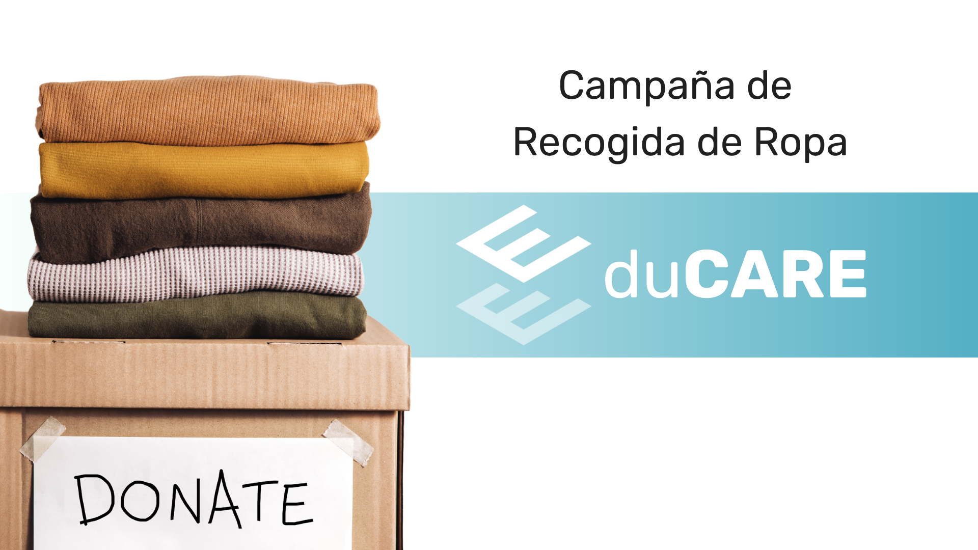 Caja de cartón con etiqueta “donate” y varios jerséis doblados encima, lista para la recogida solidaria.